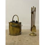 A brass four piece fireside companion set on stand, mid to late 20th century, (H64cm) together