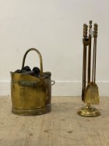 A brass four piece fireside companion set on stand, mid to late 20th century, (H64cm) together