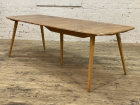 Ercol, an elm extending dining table, the shaped rectangular top with folding leaf raised on five