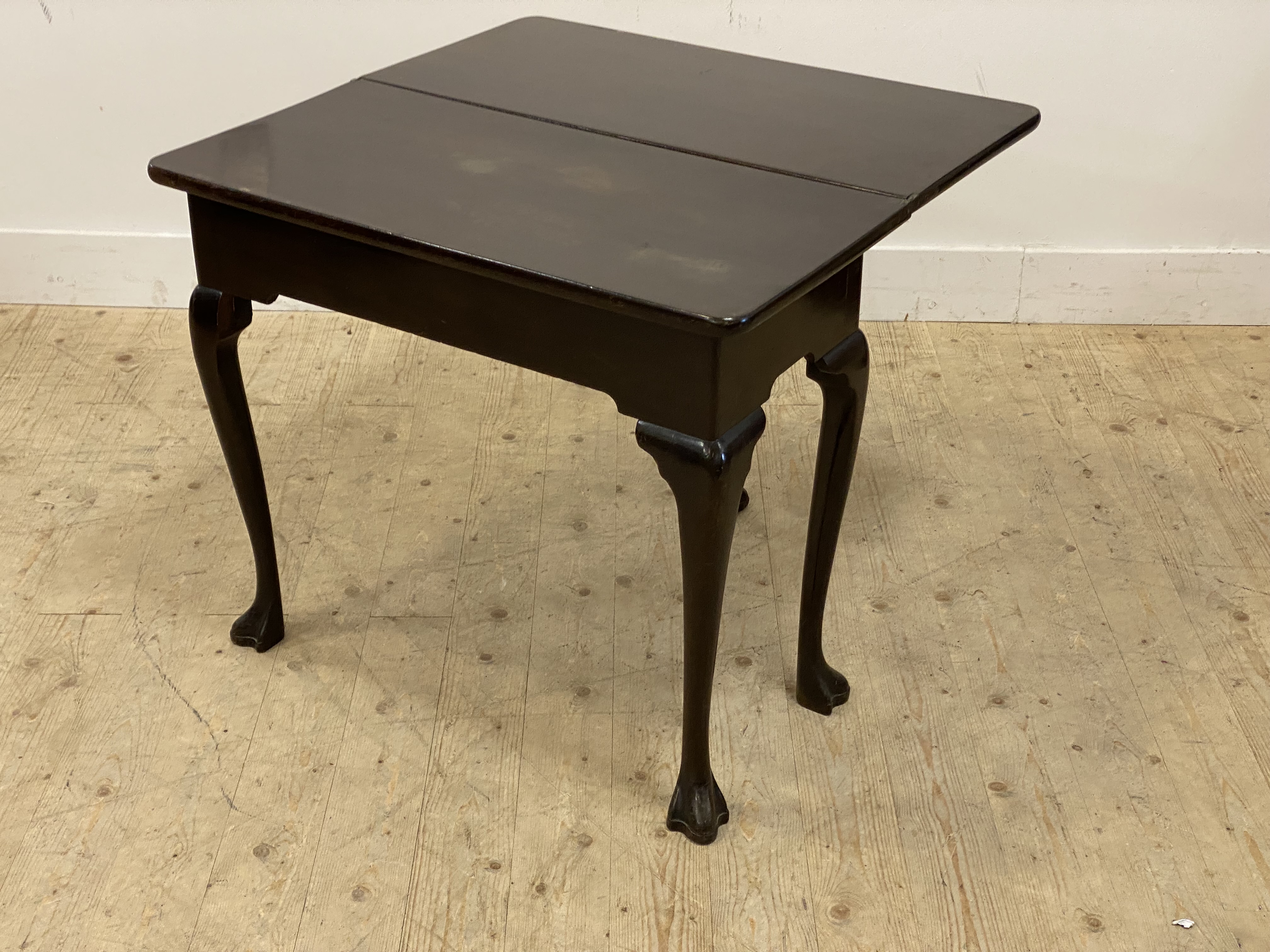 A George III Irish mahogany fold over tea table, the top raised on cabriole supports with paw carved - Image 2 of 2