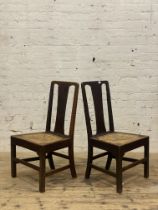 A pair of George III country oak chairs, each with plain splat back over a woven string seat and