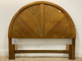 A Canadian oak standard double arched headboard. H137cm, W155cm.