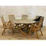A hardwood garden suite, comprising a set of five folding elbow chairs complete with seat pads (