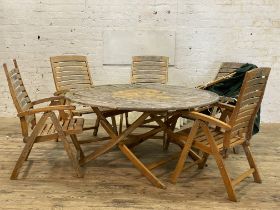 A hardwood garden suite, comprising a set of five folding elbow chairs complete with seat pads (