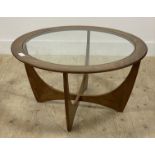 G-Plan, a mid century teak coffee table, the circular top inset with glass panel raised on four