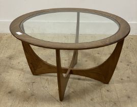 G-Plan, a mid century teak coffee table, the circular top inset with glass panel raised on four