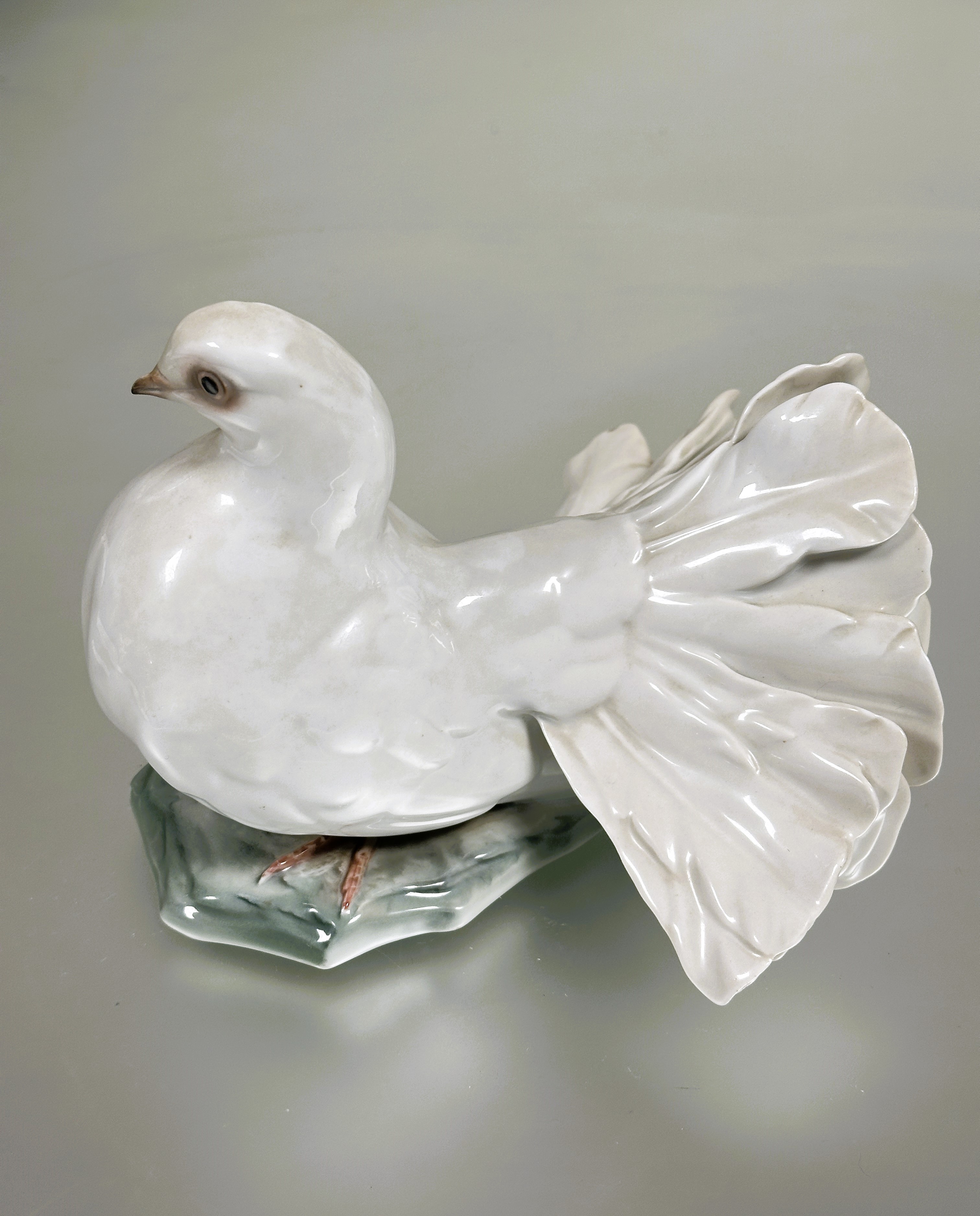 A German Rosenthal porcelain fantail dove figure decorated with polychrome enamels on naturalistic - Image 2 of 5