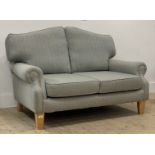 Isla Mae, a traditional two seat sofa, well upholstered in herringbone / tweed wool fabric, raised
