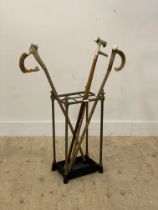 A Victorian brass and cast iron five division stick stand, with urn finials and original drip