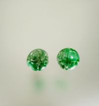 A pair of carved circular celadon jade stud earrings mounted in 18ct white gold D x 1cm 3.52g