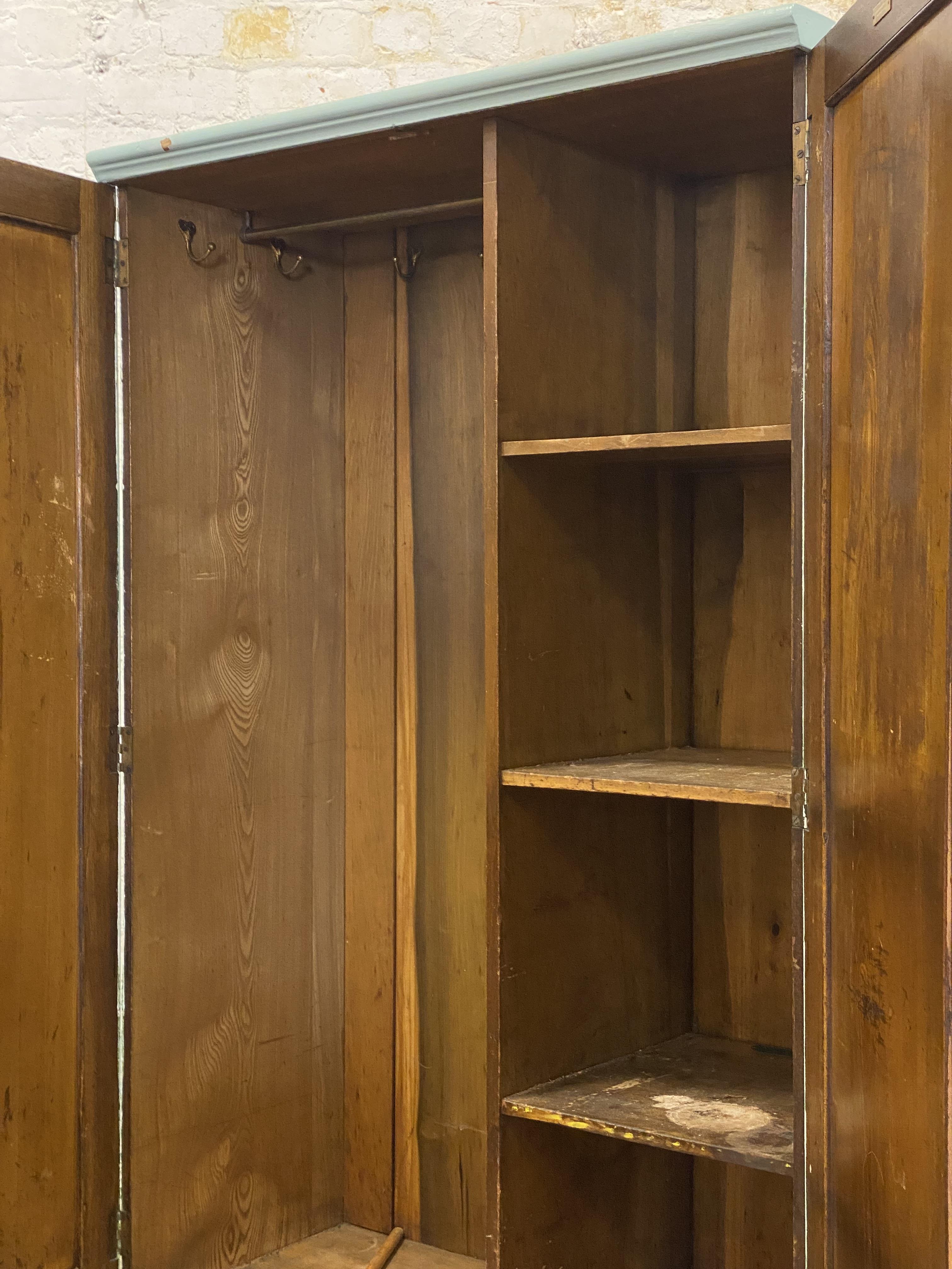An early 20th century oak cupboard, later painted in blue, with two panelled doors enclosing an - Image 2 of 2