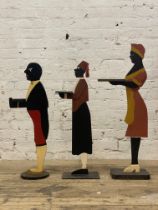 A group of three painted butler silhouettes. H102cm.