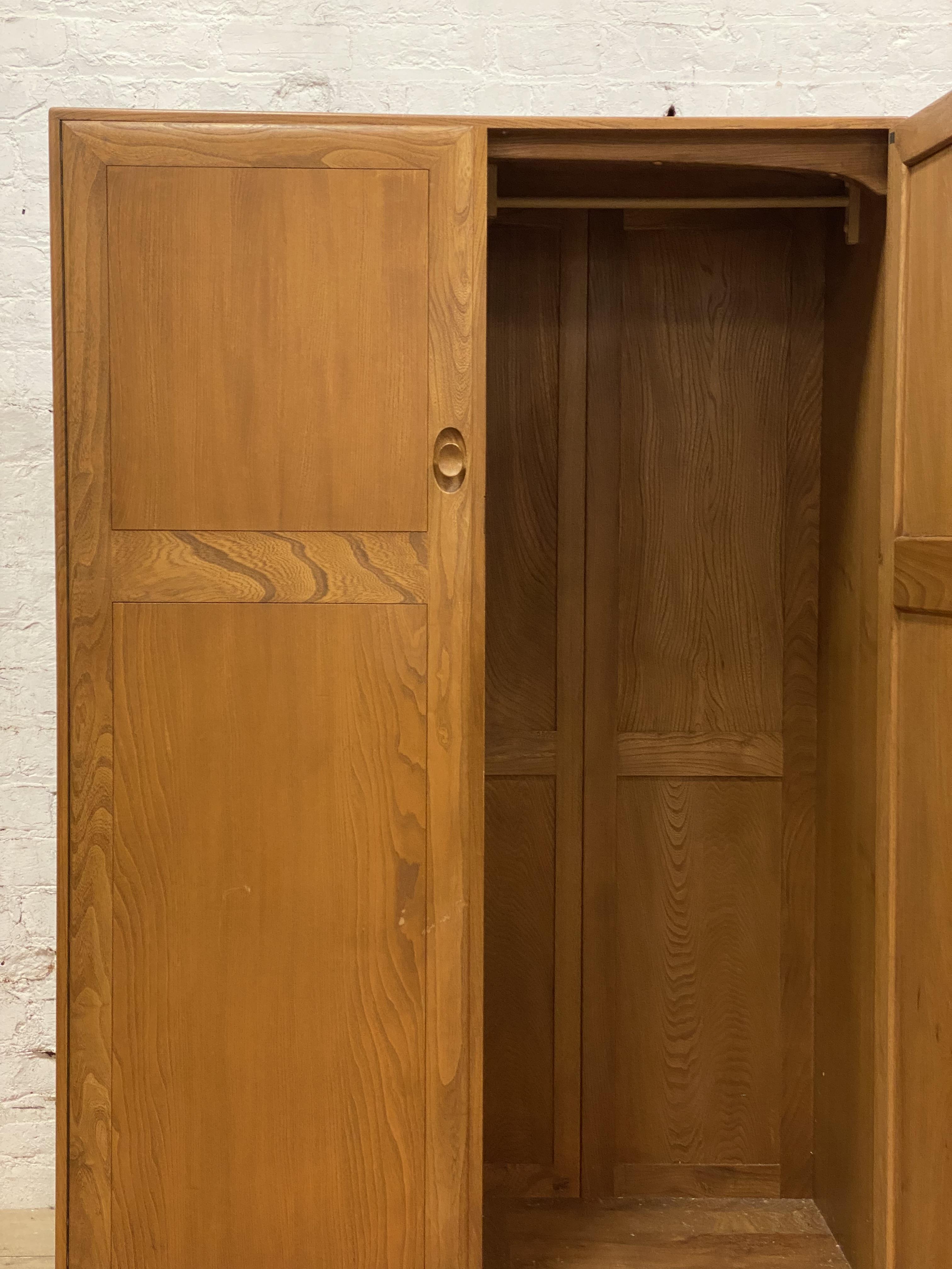 Ercol, a beech and elm double wardrobe, the two twin panel doors opening to an interior fitted for - Image 2 of 2