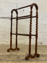 A Victorian walnut five rung towel rail with spiral turned supports. H90cm, W65cm.
