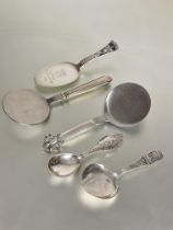 A collection of Danish silver to include and four various shaped pastry/ serving spoons two with