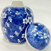 A Qing Dynasty blue and white porcelain prunus blossom pattern ginger jar in the Kangxi taste (