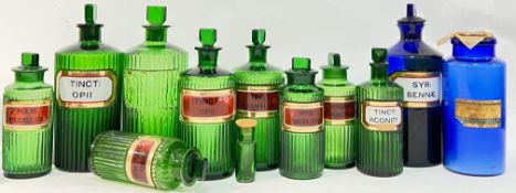 A group of coloured glass apothecary/chemist jars comprising ten green glass jars (mostly fluted