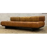 Heals, a mid century low sofa, circa 1980, the squab cushions upholstered in tan leather, and raised