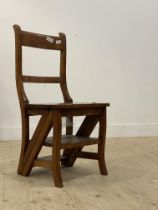 A Victorian style hardwood metamorphic chair, folding over to form a three rung library step ladder.