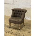 A Victorian style bedroom chair, upholstered in buttoned grey linen and raised on limed oak turned
