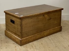 A late 19th century pine blanket box, the hinged lid opening to a candle box to interior. H44cm,