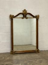 A French style gilt wood wall hanging mirror, with acanthus carved and scrolled frame. 128cm x 87cm.