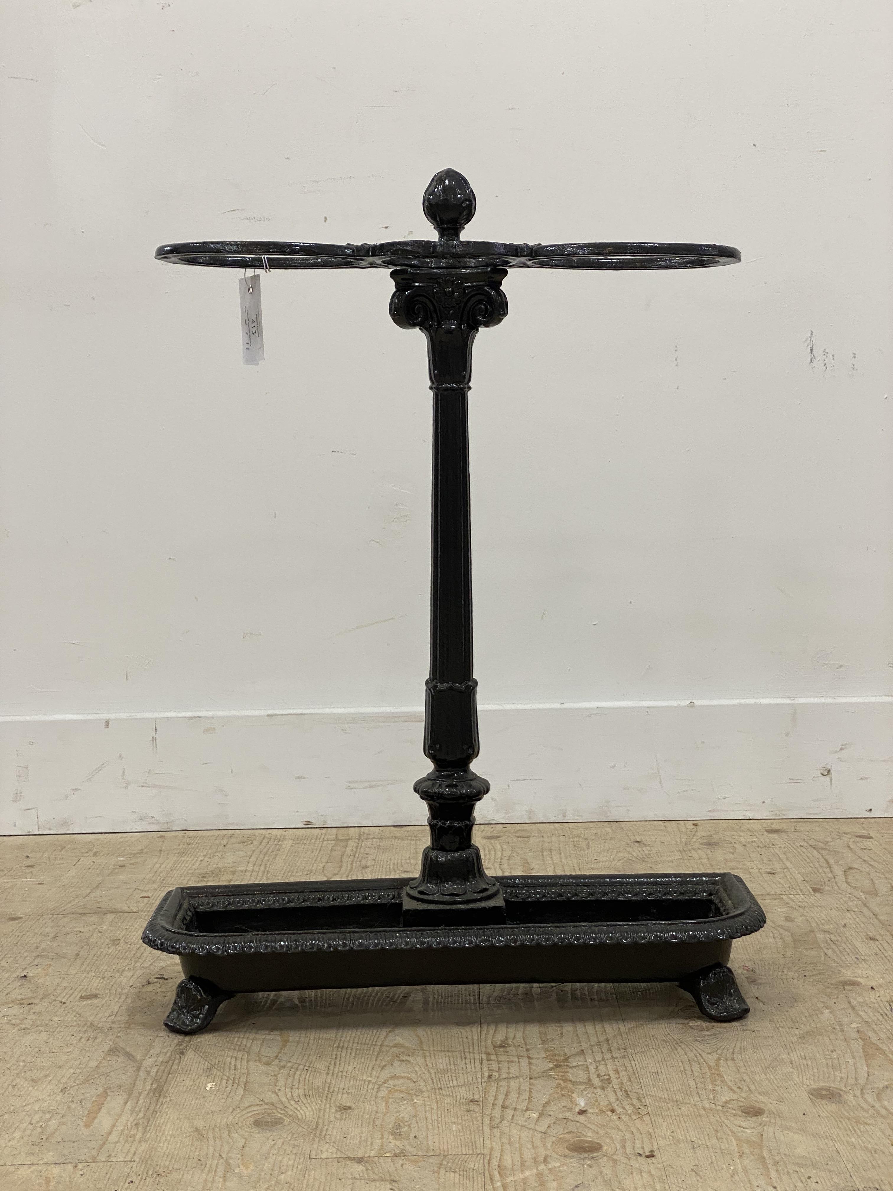 A Victorian cast iron stick stand, two divisions on an ionic column and above a drip tray, raised on - Image 2 of 2