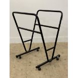 A modern folio or picture stand, tubular construction moving on castors. H89cm.