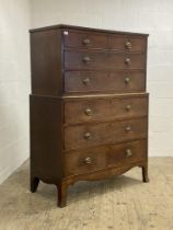 A George III mahogany chest on chest, of squat form, the top section fitted with two short and two