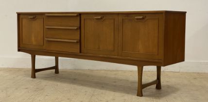 A mid century teak sideboard by Stonehill Furniture, of  rectangular outline, fitted with three