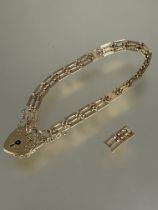 A 9ct gold gate link bracelet complete with safety chain and heart shaped padlock with two extra