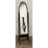 A Queen Anne style cheval mirror, the mahogany frame enclosing an undulating mirror plate swivelling