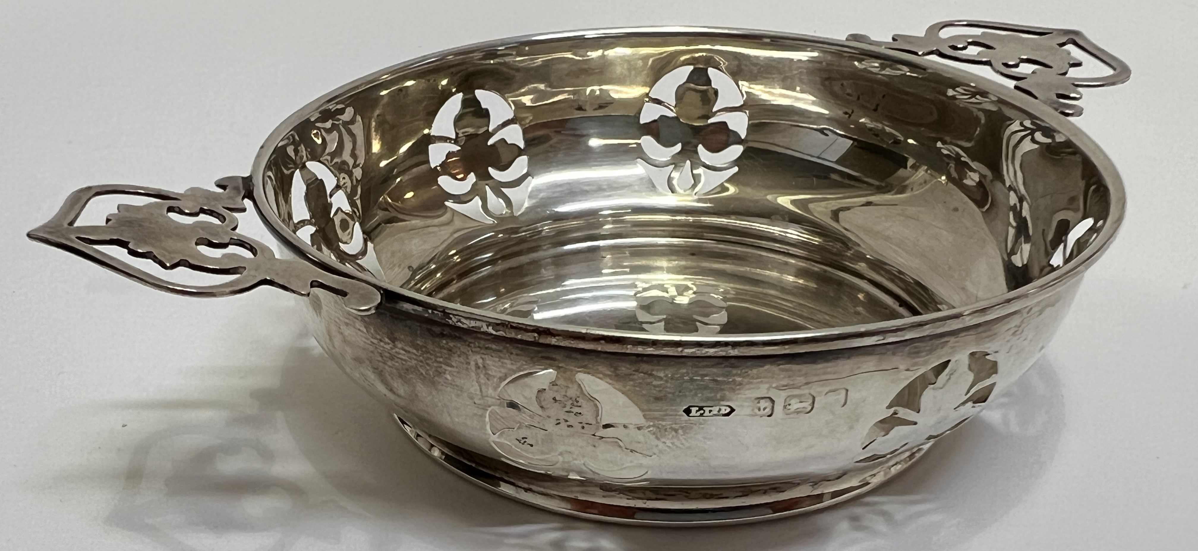 A George VI Birmingham hallmarked (1939) silver pierced edge quaich-form dish by Lanson Ltd