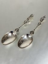 A pair of Victorian Sheffield silver apostle spoons with spiral open stems with cherub mounted bowls