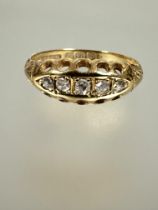 A Edwardian 18ct gold ring set five graduated old mine cut diamonds in four claw setting K 1.88g