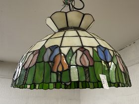 A Tiffany style lead glazed and stained glass pendent light fitting (small break to one pane of
