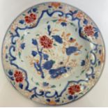 A Qianlong period Chinese porcelain dish decorated in polychrome enamels with floral sprays (famille