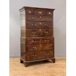 A George II walnut chest on chest or tallboy, mid 18th century, the projecting cornice over a