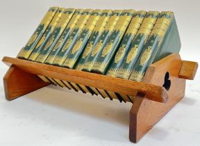 An Arts and Crafts oak book trough with Shakespeare Knight's Cabinet volume 1 - 12