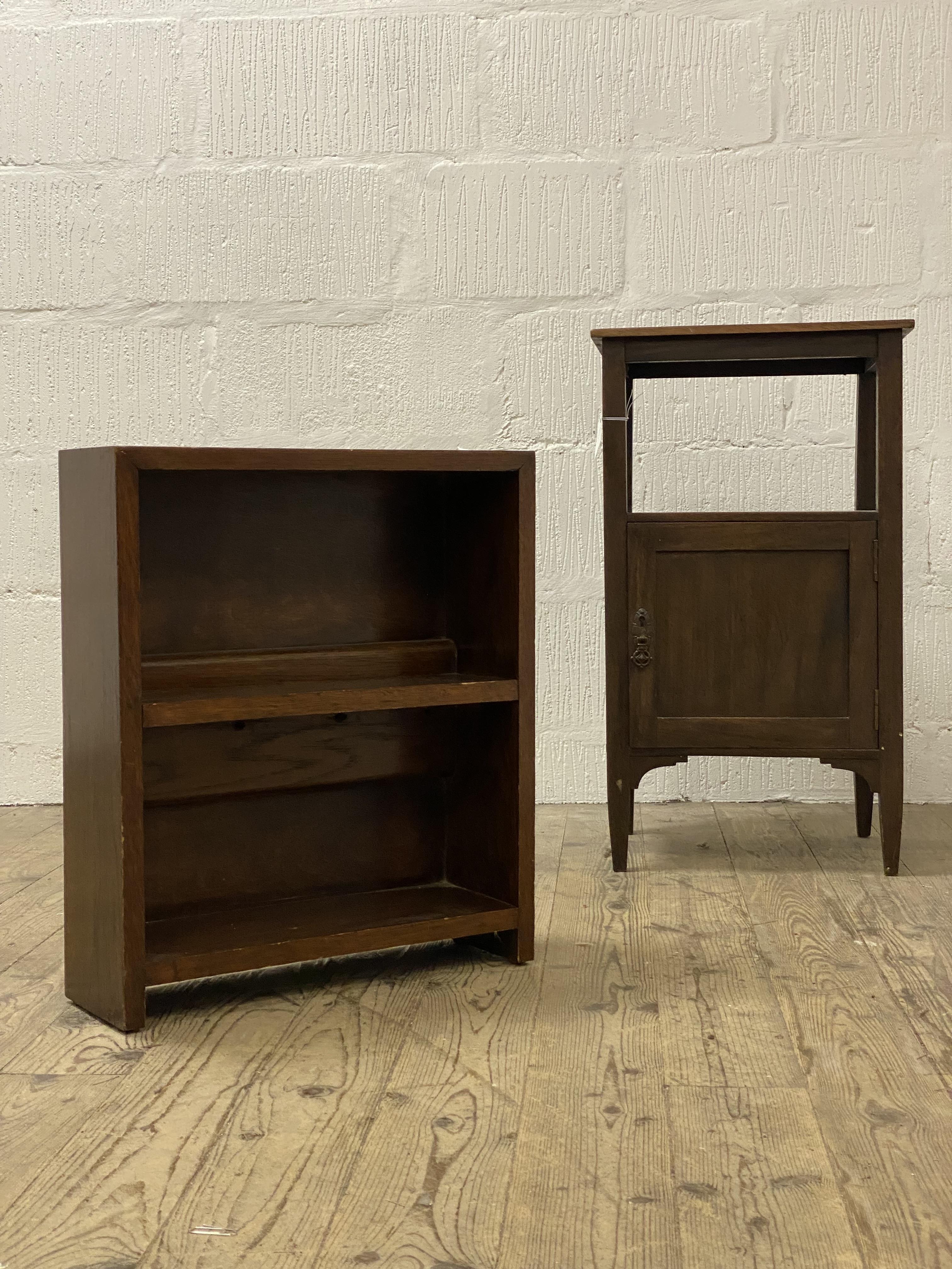 A 19th century stained mahogany bedside table, the open shelf above a cupboard and raised on
