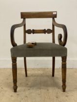 A Regency mahogany elbow chair, circa 1820's, the curved crest rail above a bar back with palmette