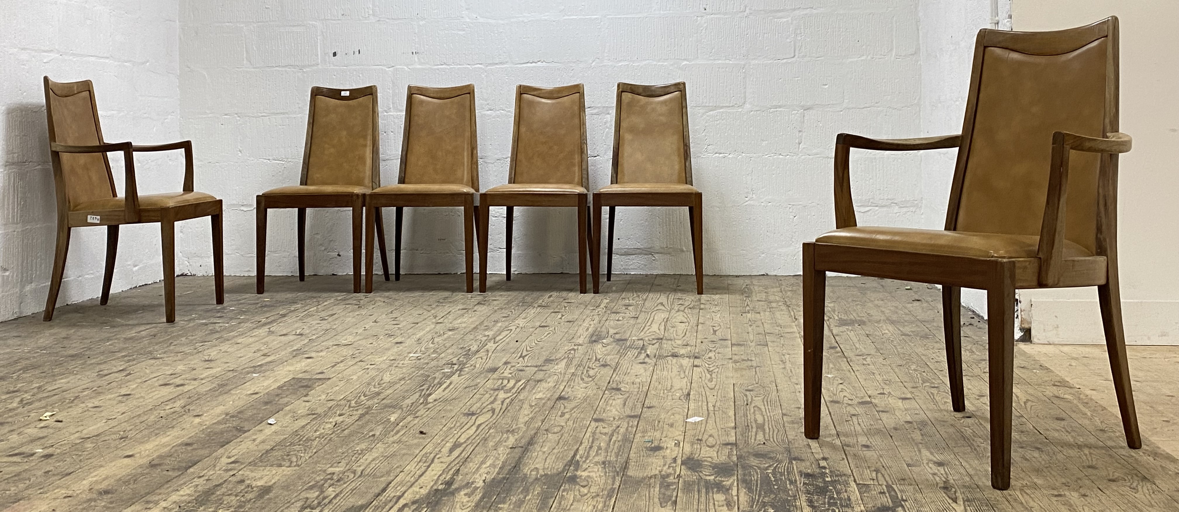 G-Plan, a set of six (4+2) teak high back dining chairs, each with tan leather upholstered seat