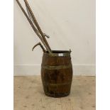 A 19th century cooped oak stick stand of barrel form, with brass swing handle (H51cm) together
