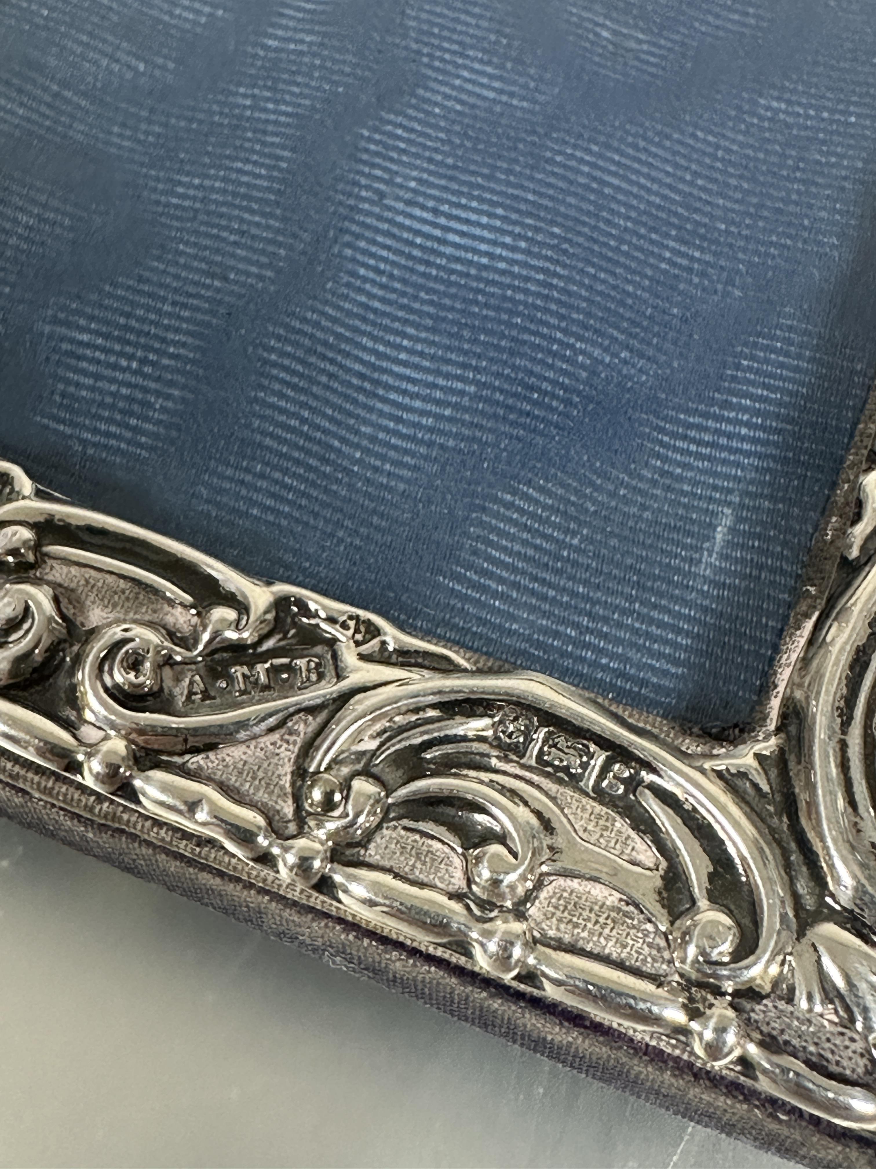 A Edwardian silver chased photograph frame of rectangular form with allover C scroll design - Image 2 of 4