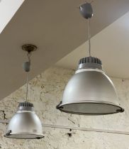 A pair of Italian Industrial style pendent light fittings by Castaldi, with brushed aluminium cases.