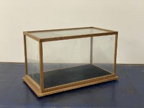 A glazed oak table show case, early 20th century. H29cm, L50cm, D27cm.