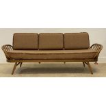 Ecol, a light elm and beech 'Surfboard' sofa, panel back above hoop and spindle arms, the squab