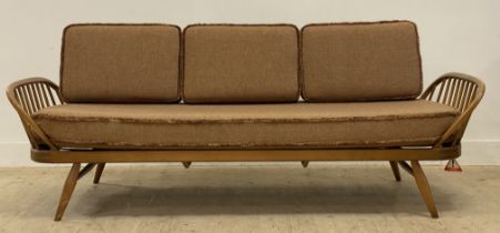 Ecol, a light elm and beech 'Surfboard' sofa, panel back above hoop and spindle arms, the squab