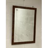 A burr walnut framed wall hanging mirror with bevelled glass. 50cm x 73cm.