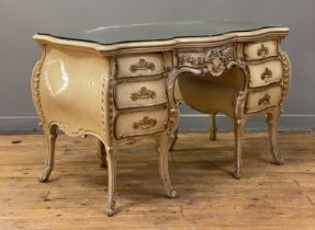 A Neo-Rococo dressing table or desk, late 19th century, cream painted and parcel gilt hardwood,